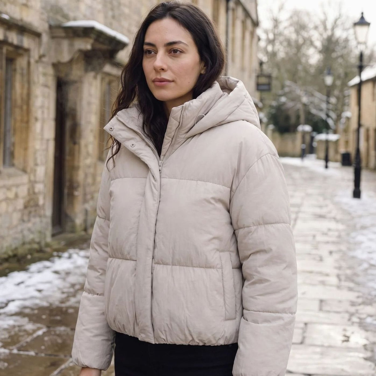 Homixa women's full-zip cropped puffer jacket with hood, boxy fit, and quilted shell, displayed on a model against a neutral background.