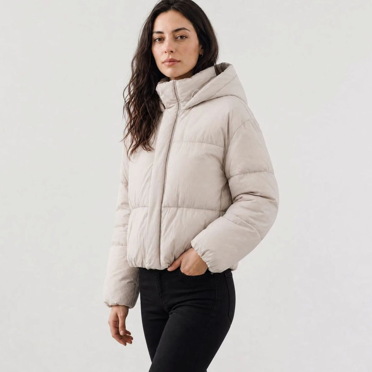 Women's Homixa full-zip cropped puffer jacket with hood, boxy fit, and quilted shell, displayed on a model.