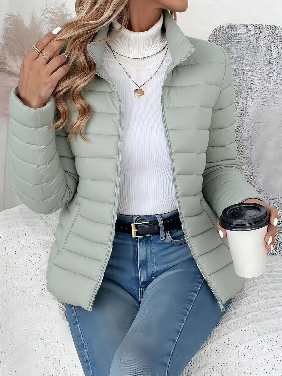 Women's Quilted Winter Jacket by Homixa with full zip, slim fit, and stand collar, suitable for cold weather.