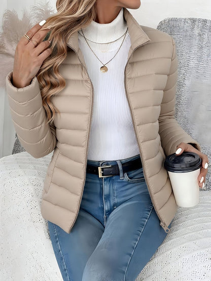 Women's Homixa quilted winter jacket with full zip, slim fit, and stand collar, perfect for cold weather.