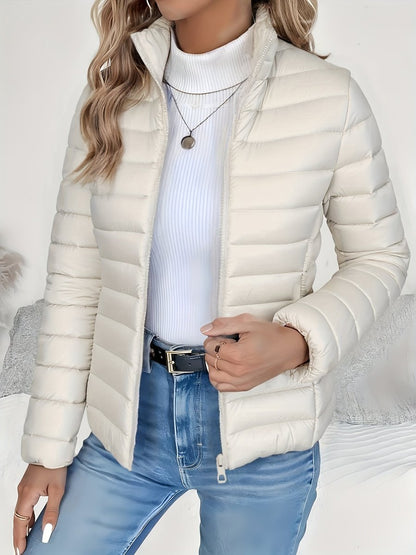 Women's full-zip quilted winter jacket by Homixa with slim fit and stand collar, showcasing the stylish and warm outerwear design.
