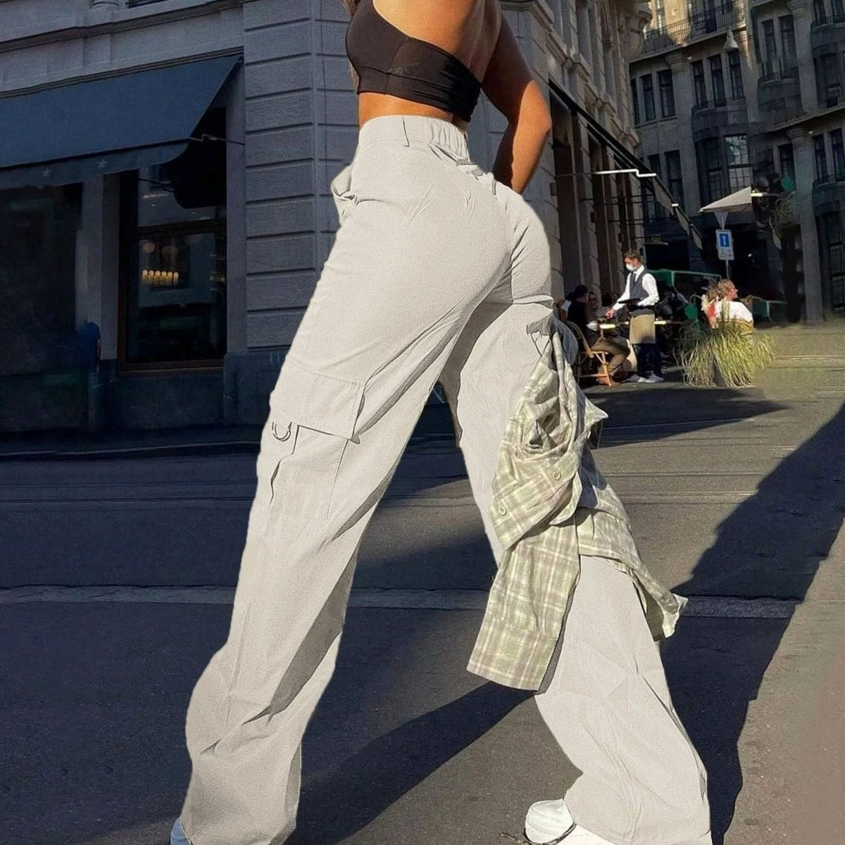 Women's high-waist wide-leg cargo pants by Homixa with functional flap thigh pockets, shown in a relaxed fit style.