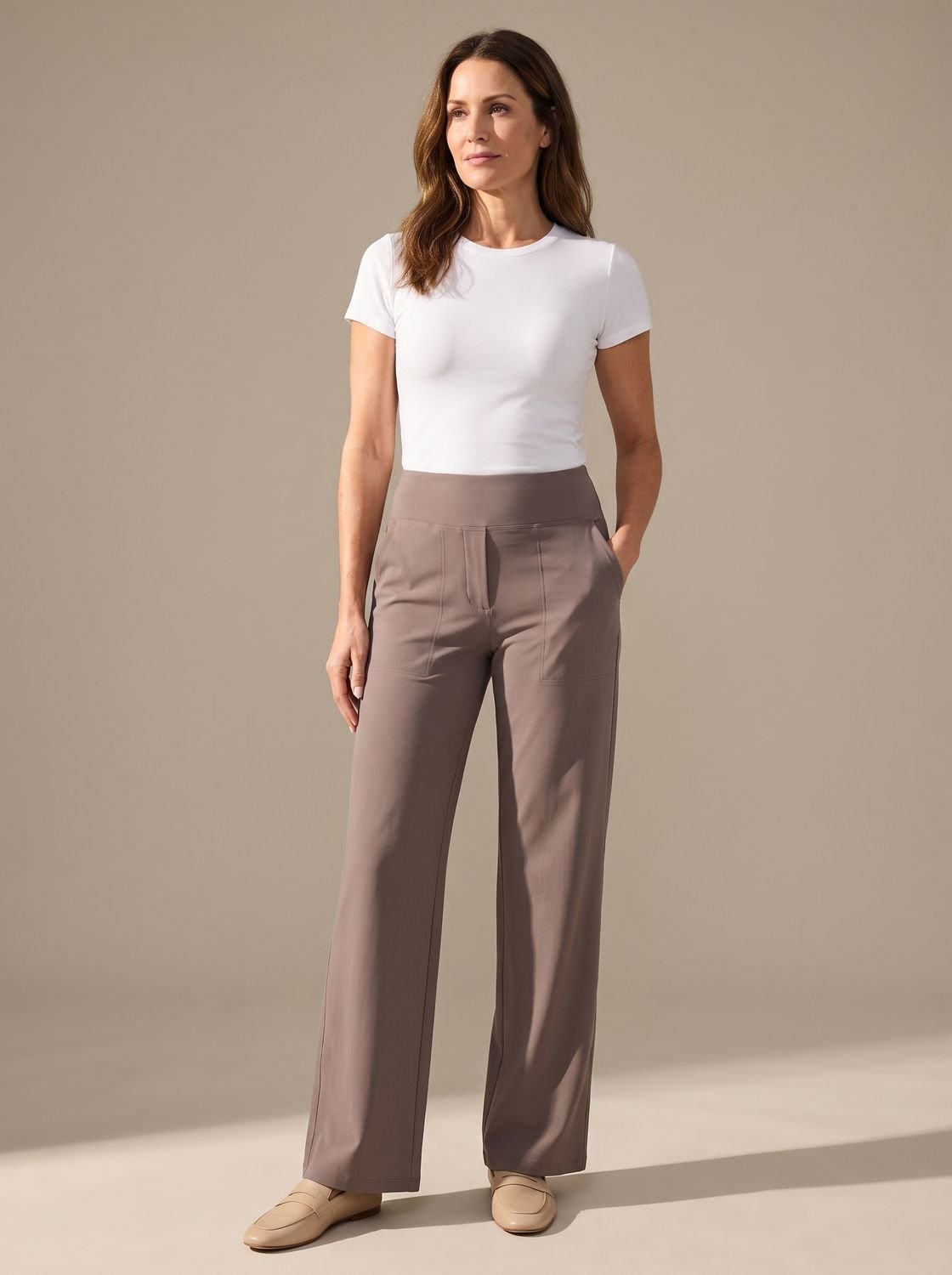 Women's high-waist wide-leg palazzo pants by Homixa with elastic waistband and side pockets, flowing fabric and relaxed fit.