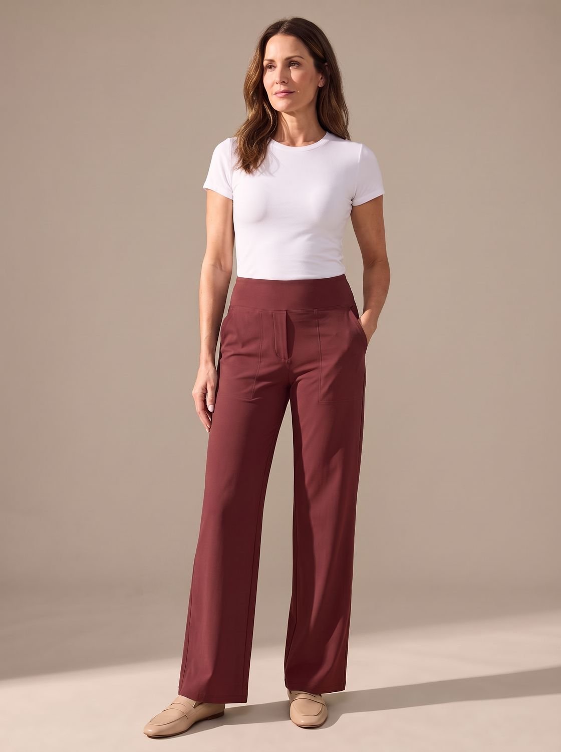 Women's high-waist wide-leg palazzo pants by Homixa with elastic waistband and side pockets, flowing fabric and relaxed fit.