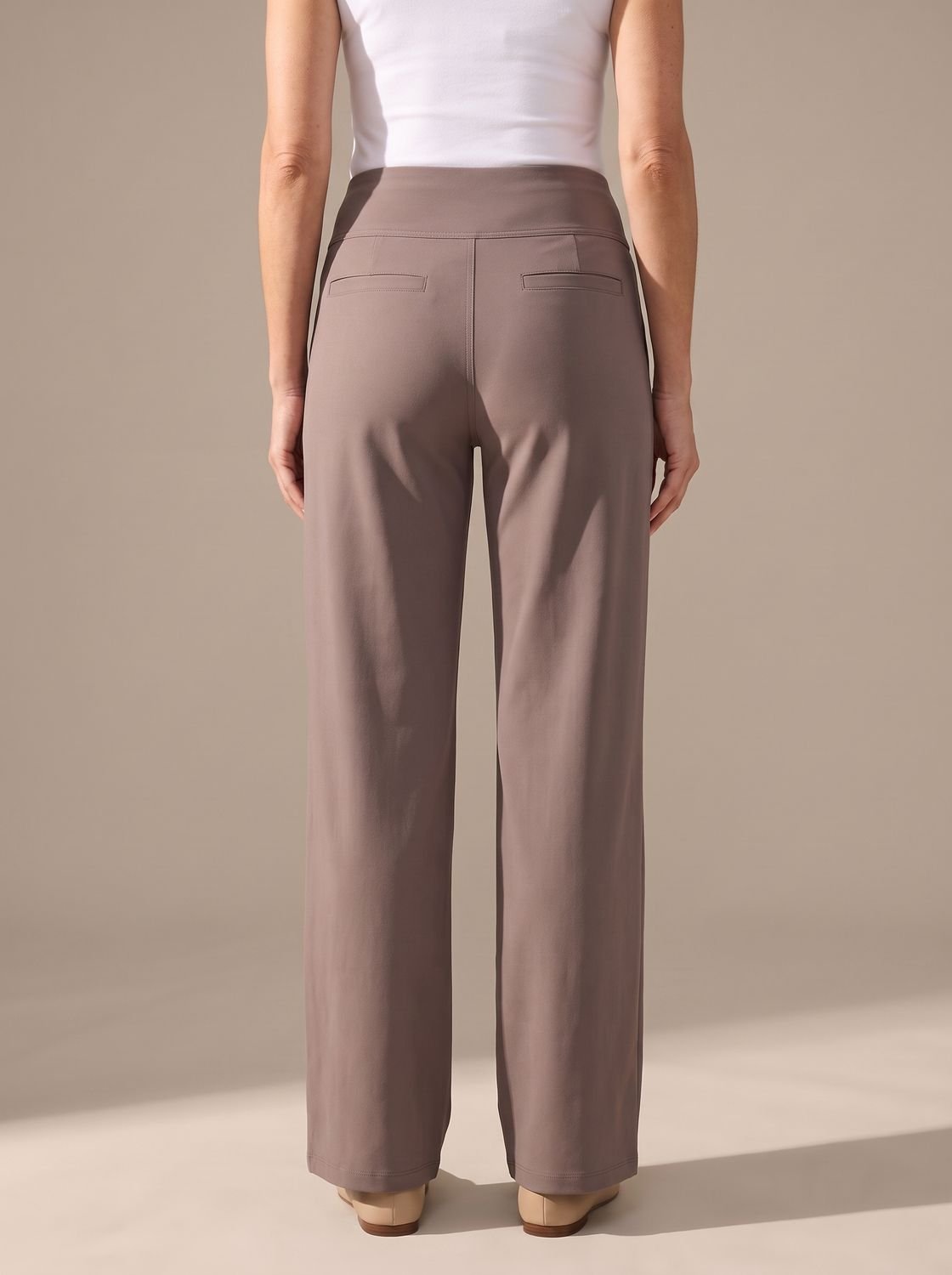 Women’s high-waist wide-leg palazzo pants by Homixa with elastic waistband and side pockets, shown on a model.