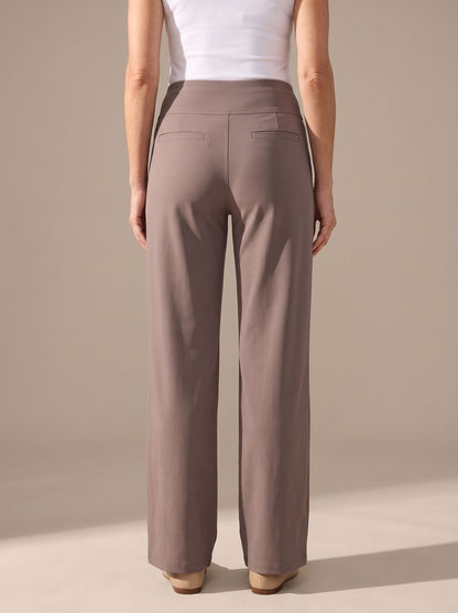 Women’s high-waist wide-leg palazzo pants by Homixa with elastic waistband and side pockets, shown on a model.