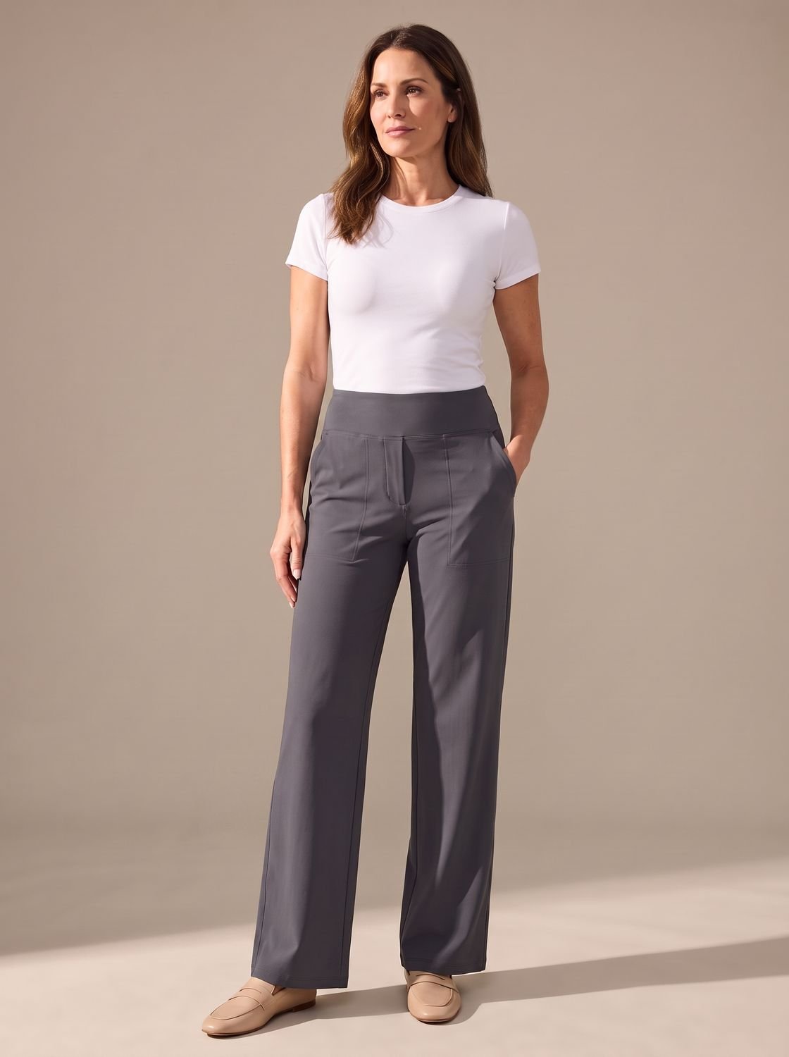 Women’s high-waist wide-leg palazzo pants by Homixa featuring elastic waistband and side pockets, displayed on a model.