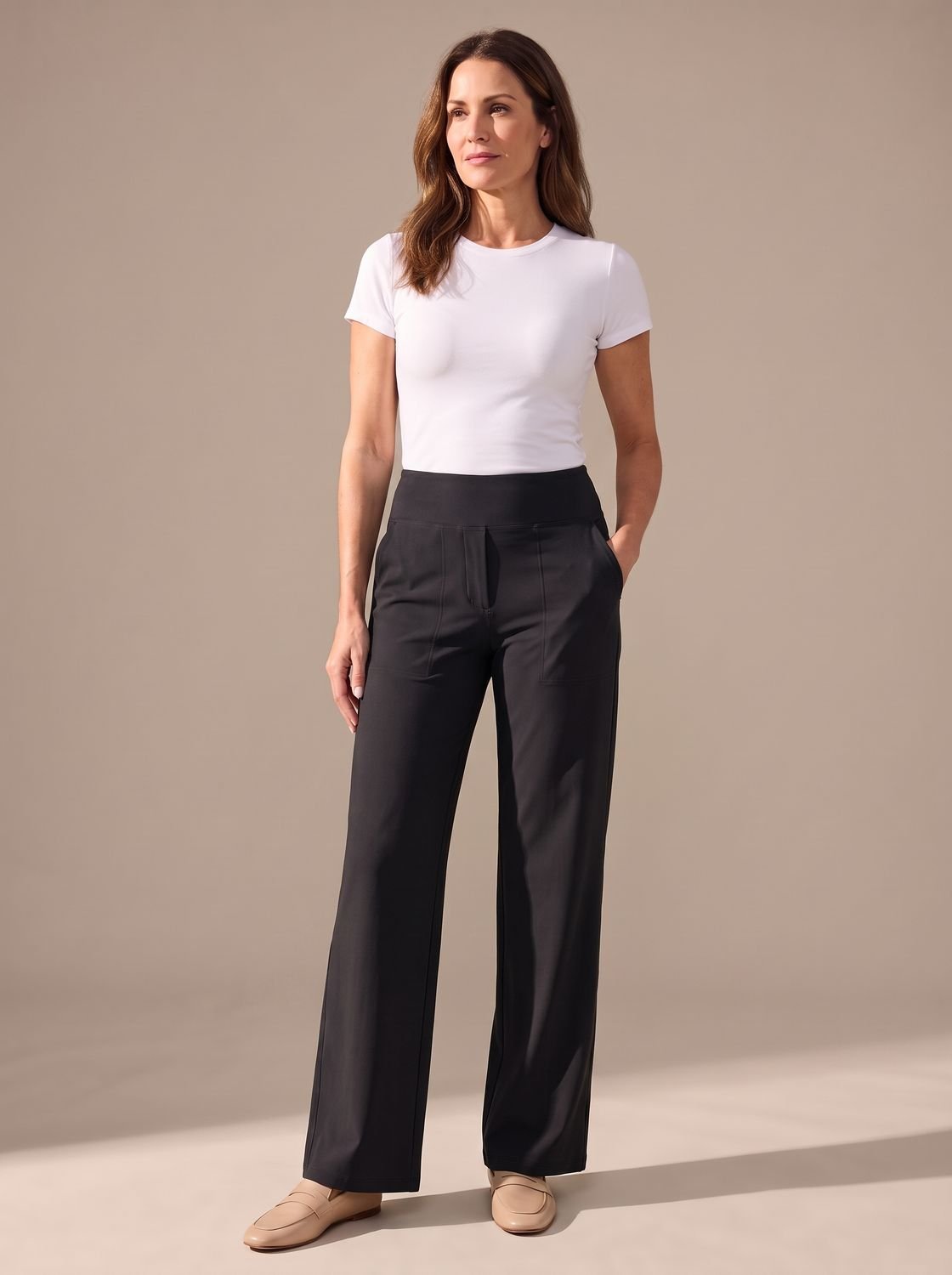 Women’s high-waist wide-leg palazzo pants by Homixa with elastic waistband and side pockets, shown from the front.