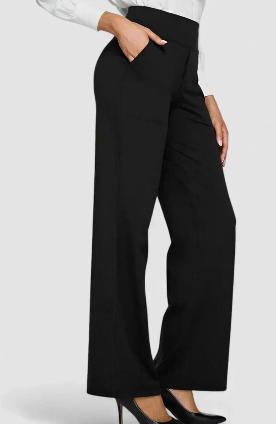 Homixa women's high-waist wide-leg trousers with elasticated waistband and deep side pockets, styled with a casual top.