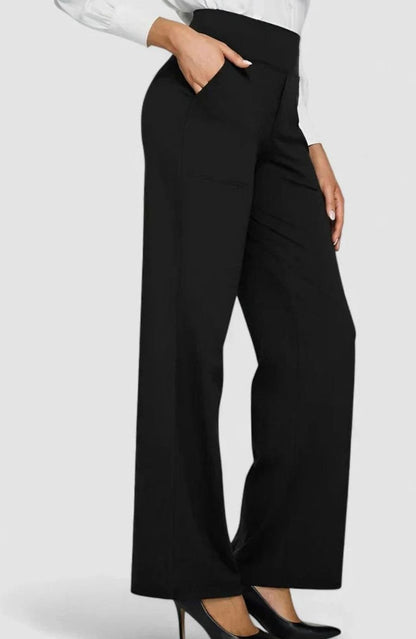 Homixa women's high-waist wide-leg trousers with elasticated waistband and deep side pockets, styled with a casual top.