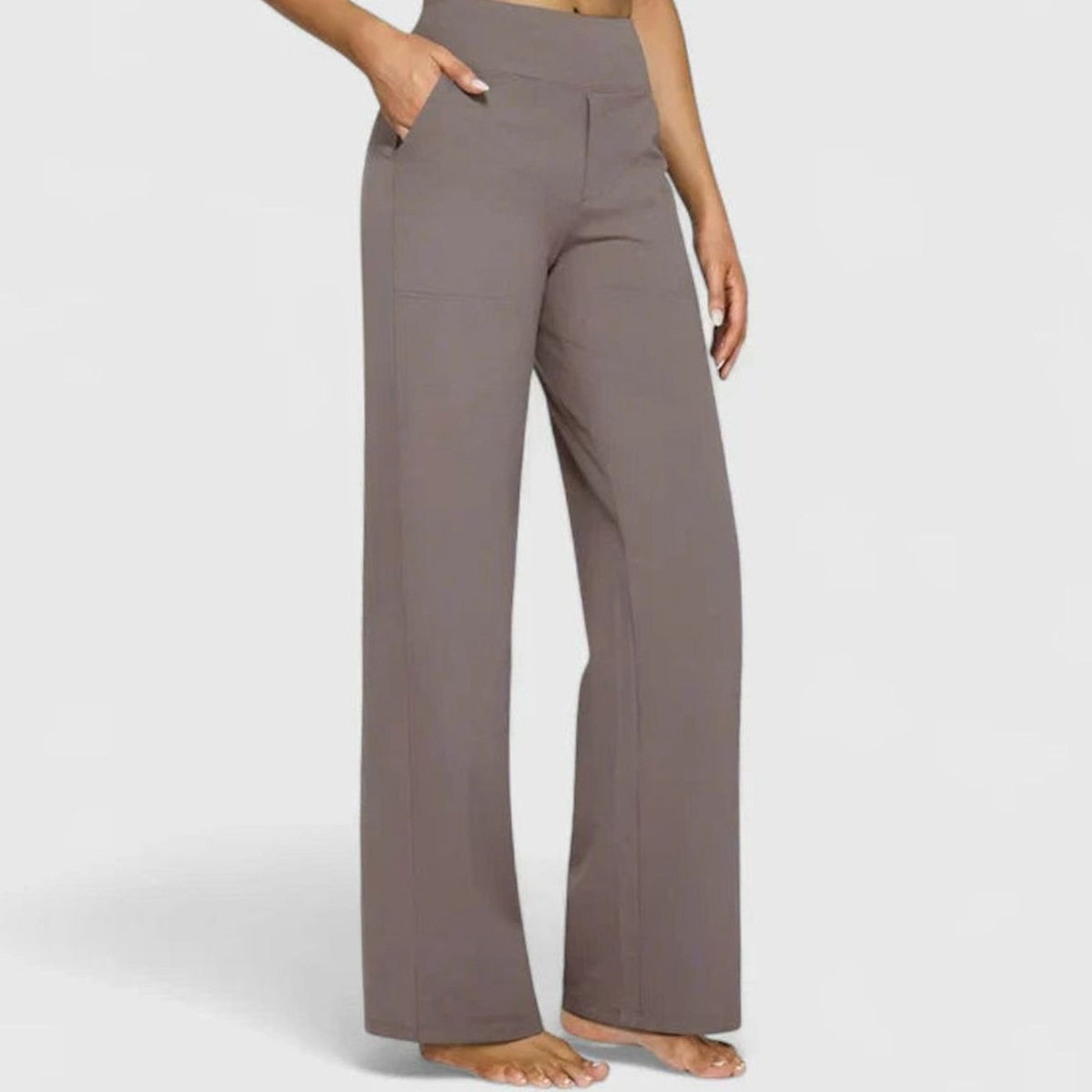 Homixa women's high-waist wide-leg trousers with elastic waistband and deep side pockets, styled for casual or office wear.