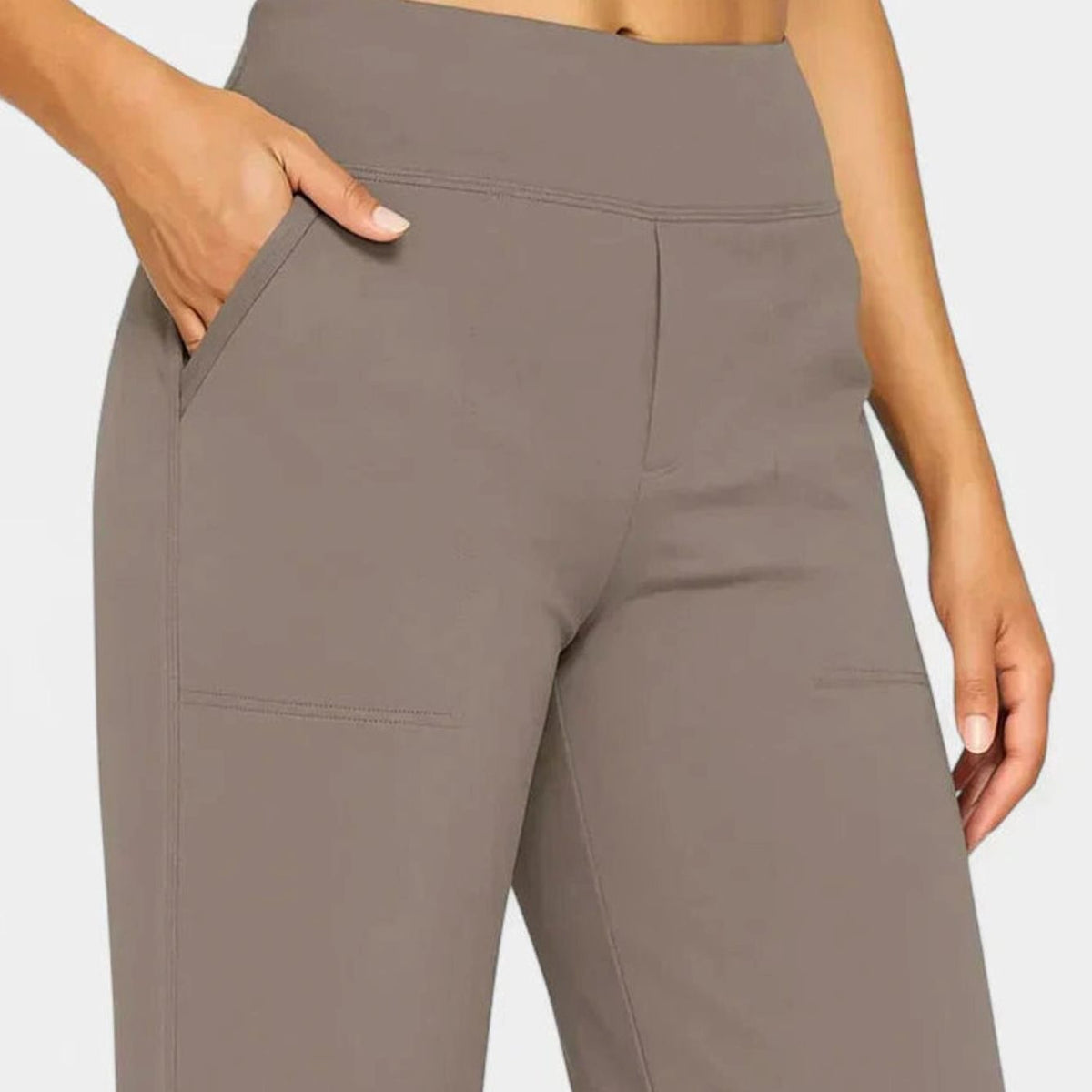 Homixa women's high-waist wide-leg trousers with elastic waistband and deep side pockets, shown on a model.