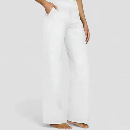 Homixa women's high-waist wide-leg trousers with elastic waistband and deep side pockets, styled for casual or office wear.