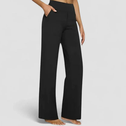 Homixa women's high-waist wide-leg trousers with elastic waistband and deep side pockets, styled for casual or office wear.