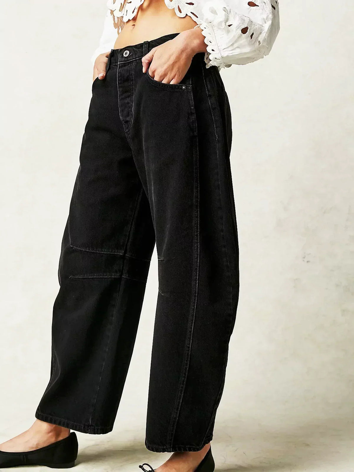 Women's high-waisted wide-leg jeans by Homixa with belt loops, front pockets, and a relaxed fit, shown on a model.