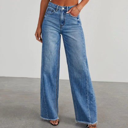 Women's high-waisted wide-leg jeans by Homixa featuring denim fabric and raw frayed hem, shown on a model.