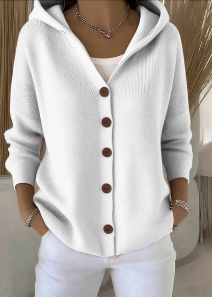 Women’s Homixa hooded button-front cardigan with relaxed fit and ribbed hem, styled with sleeves rolled up and front pockets visible.