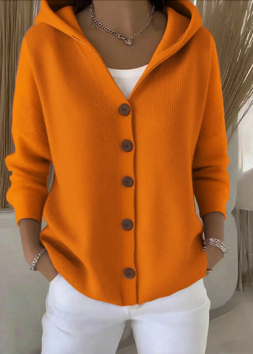 Women's Homixa hooded button-front cardigan with relaxed fit and ribbed hem, shown in a cozy, casual style.