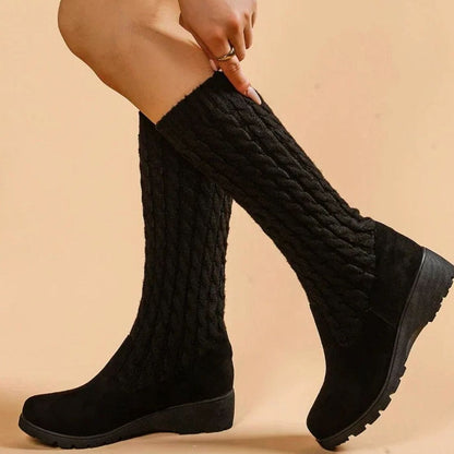 Women's knee-high boots by Homixa with suede foot, cable-knit shaft, and wedge heel, stylish and cozy fall footwear.