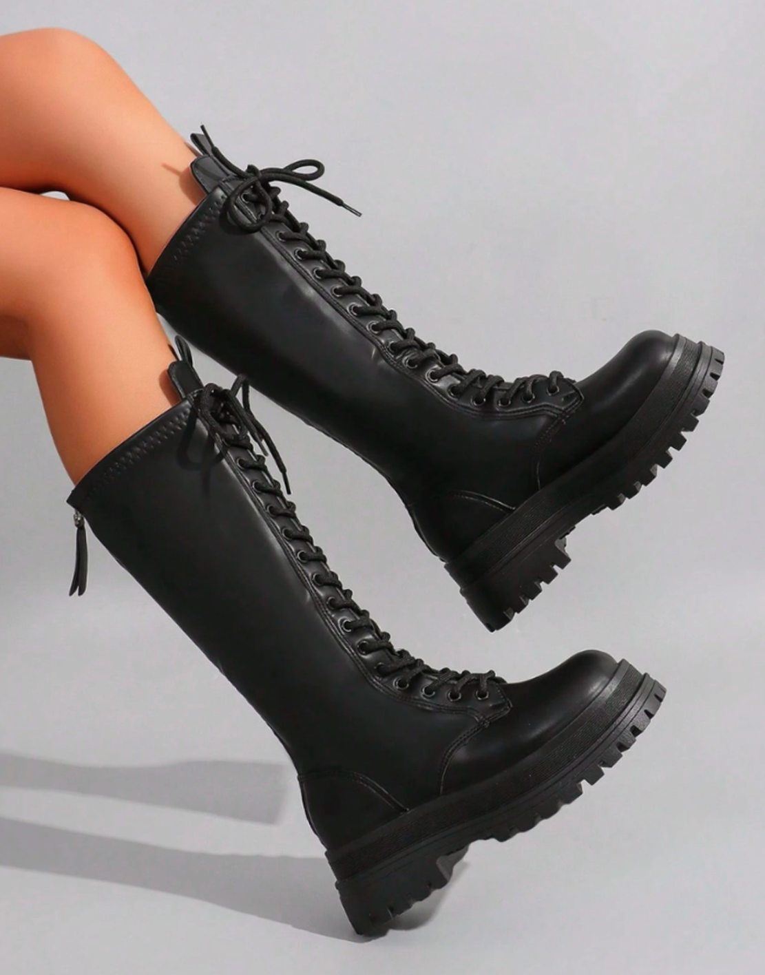 Women's faux leather knee-high boots with chunky sole and side zip closure, stylish Homixa footwear for trendy winter wear.