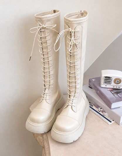 Women's knee-high faux leather boots by Homixa featuring chunky soles and side zip closure, stylish and sturdy for everyday wear.