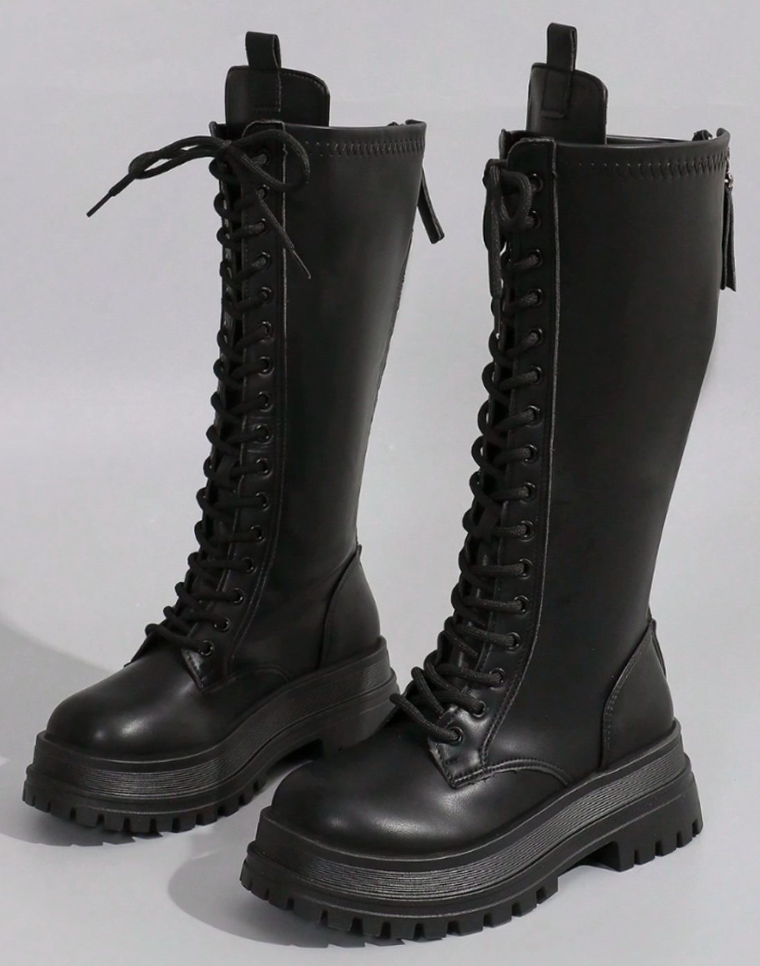 Women's knee-high faux leather boots by Homixa with chunky sole and side zip closure, stylish and durable footwear for cold weather.