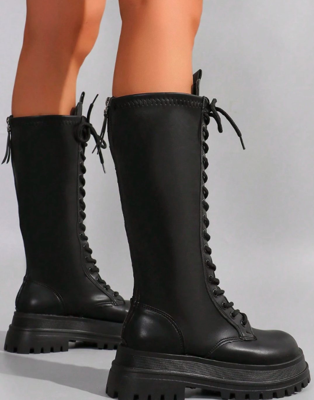 Women's knee-high faux leather boots by Homixa featuring a chunky sole and side zip closure, stylish and durable footwear.