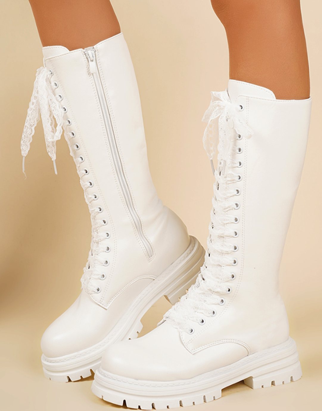Women's knee-high faux leather boots by Homixa featuring a chunky sole and side zip closure, stylish and durable footwear.
