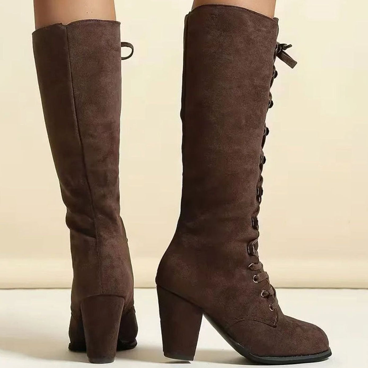 Women's knee-high lace-up boots by Homixa with round toe and mid-height block heel, showcasing stylish and comfortable footwear.