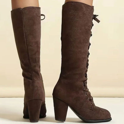 Women's knee-high lace-up boots by Homixa with round toe and mid-height block heel, showcasing stylish and comfortable footwear.