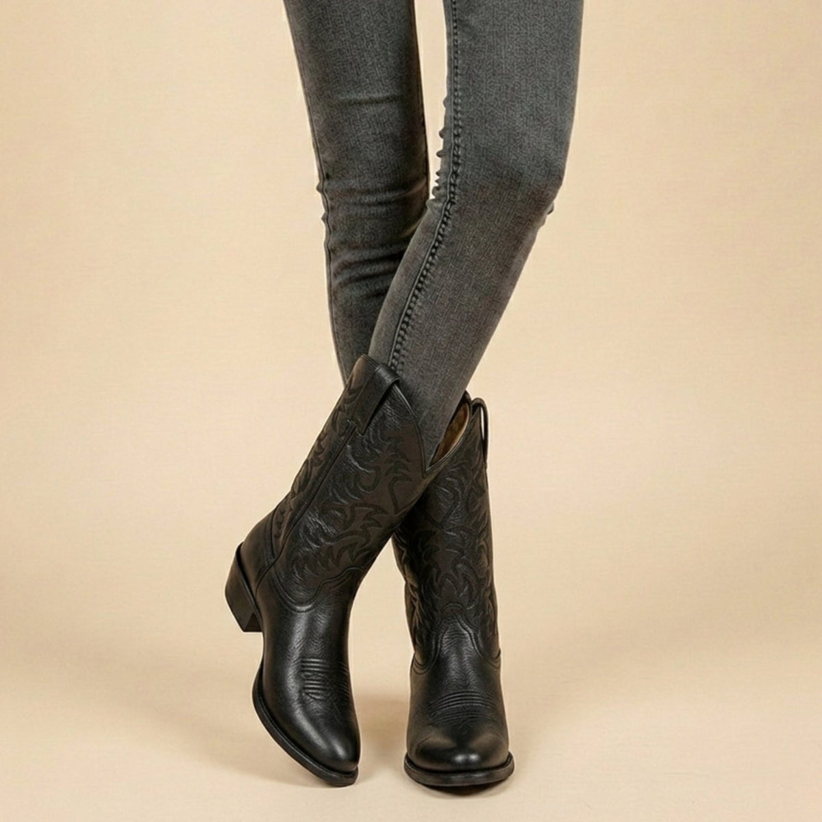 Women's knee-high western boots by Homixa with pointed toe, low block heel, and embroidered shaft featuring intricate patterns.