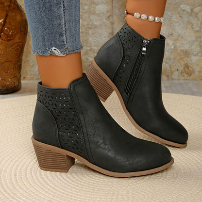 Women's Homixa laser-cut booties with floral cutout design, block heel, and side zipper for stylish comfort.