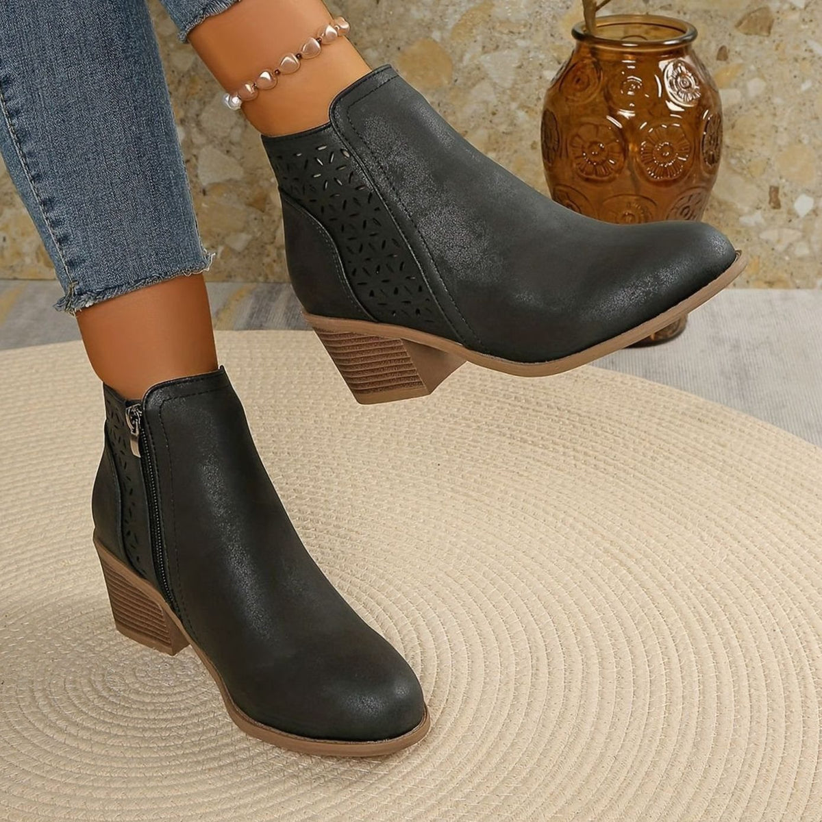 Women's Homixa laser-cut booties with floral cutouts, block heel, and side zipper for stylish, detailed footwear.