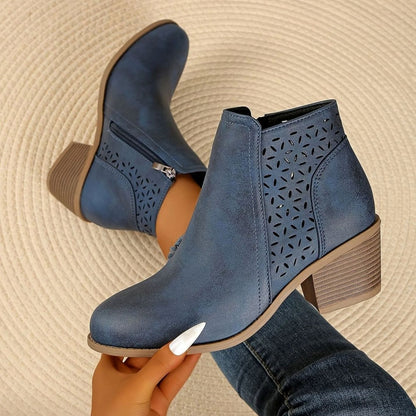 Women's Homixa laser-cut booties with floral cutout design, block heel, and side zipper for stylish comfort.