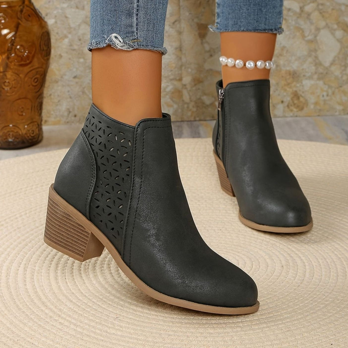 Homixa women's laser-cut booties with floral cutout design, block heel, and side zipper for stylish and comfortable wear.