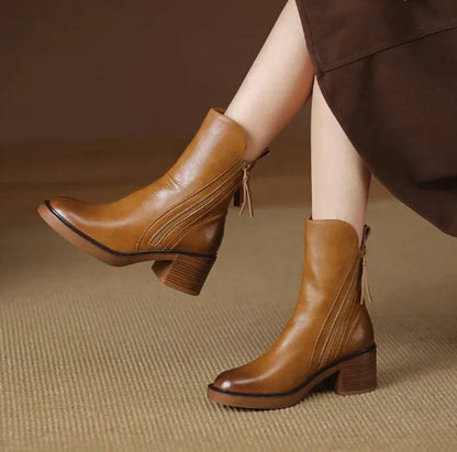 Homixa women's leather ankle booties with 5 cm block heel and side zipper, showcasing stylish design and sleek black leather finish.