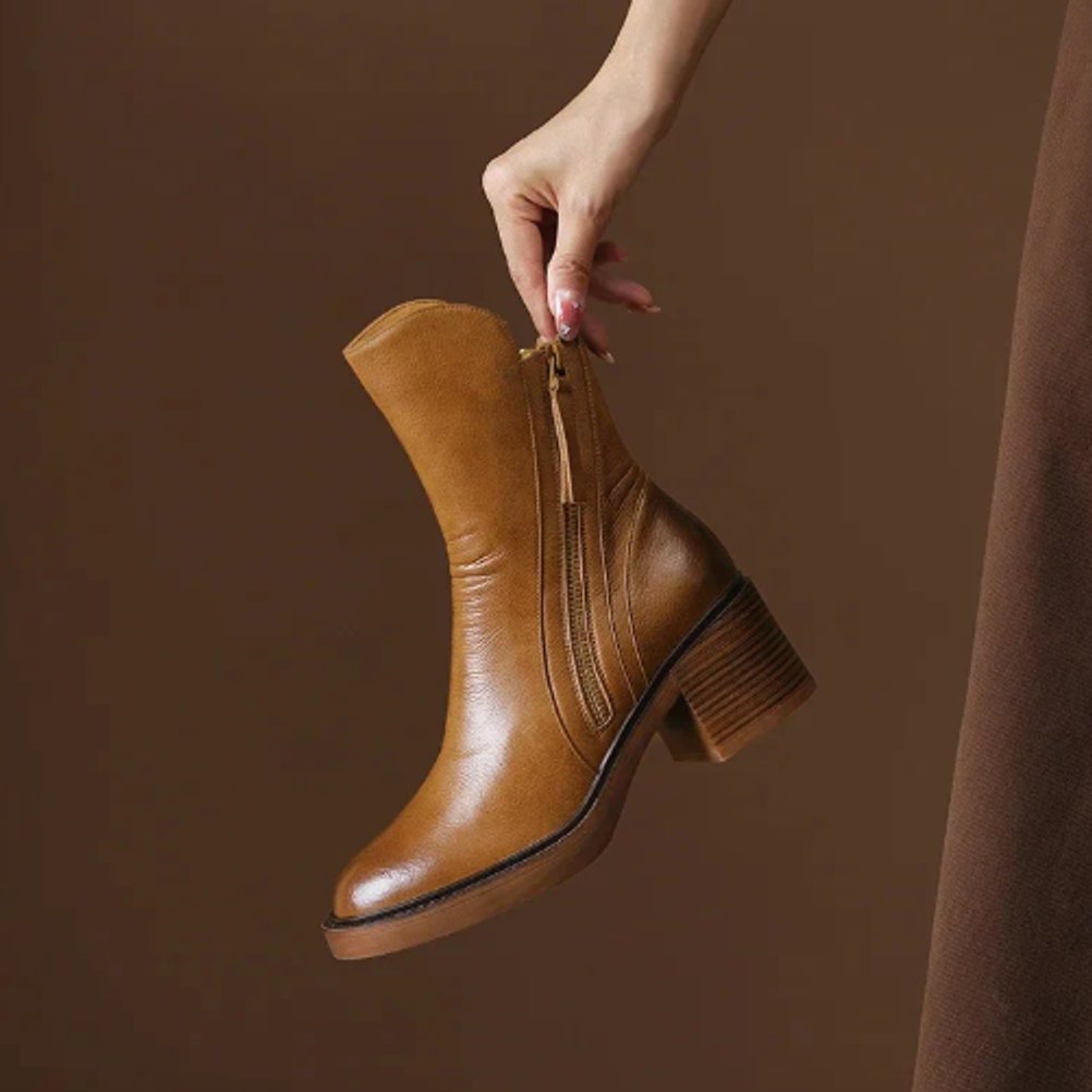 Homixa women's leather ankle booties with 5 cm block heel, side zip closure, featuring sleek design and ankle-length fit.