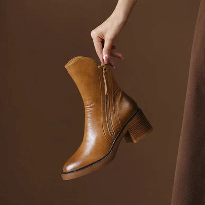 Homixa women's leather ankle booties with 5 cm block heel, side zip closure, featuring sleek design and ankle-length fit.