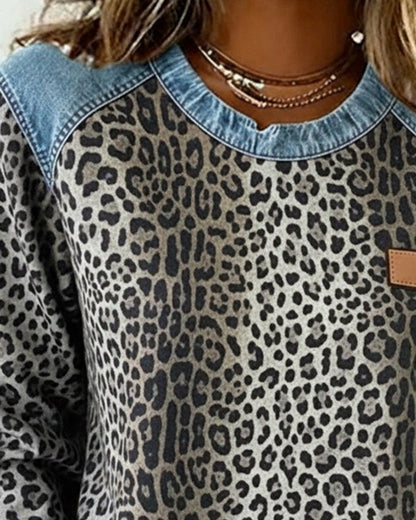Women's leopard-print pullover sweater by Homixa with denim-look raglan panels and cuffs, featuring a stylish patchwork design.