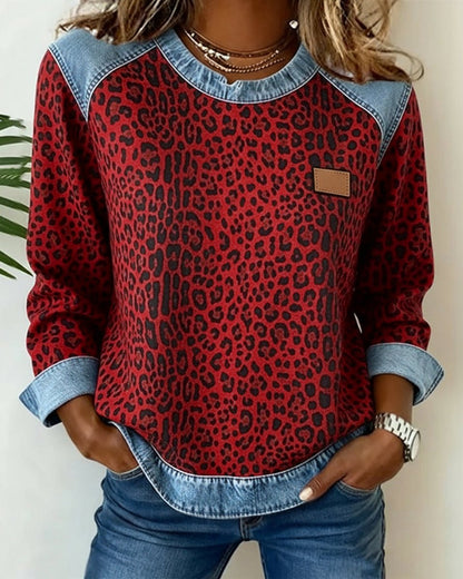 Women's leopard-print patchwork sweatshirt by Homixa featuring denim-look raglan panels and cuffs.
