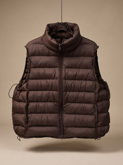 Women's lightweight sleeveless puffer vest by Homixa with stand collar and two-way zipper, shown on model in outdoor setting.