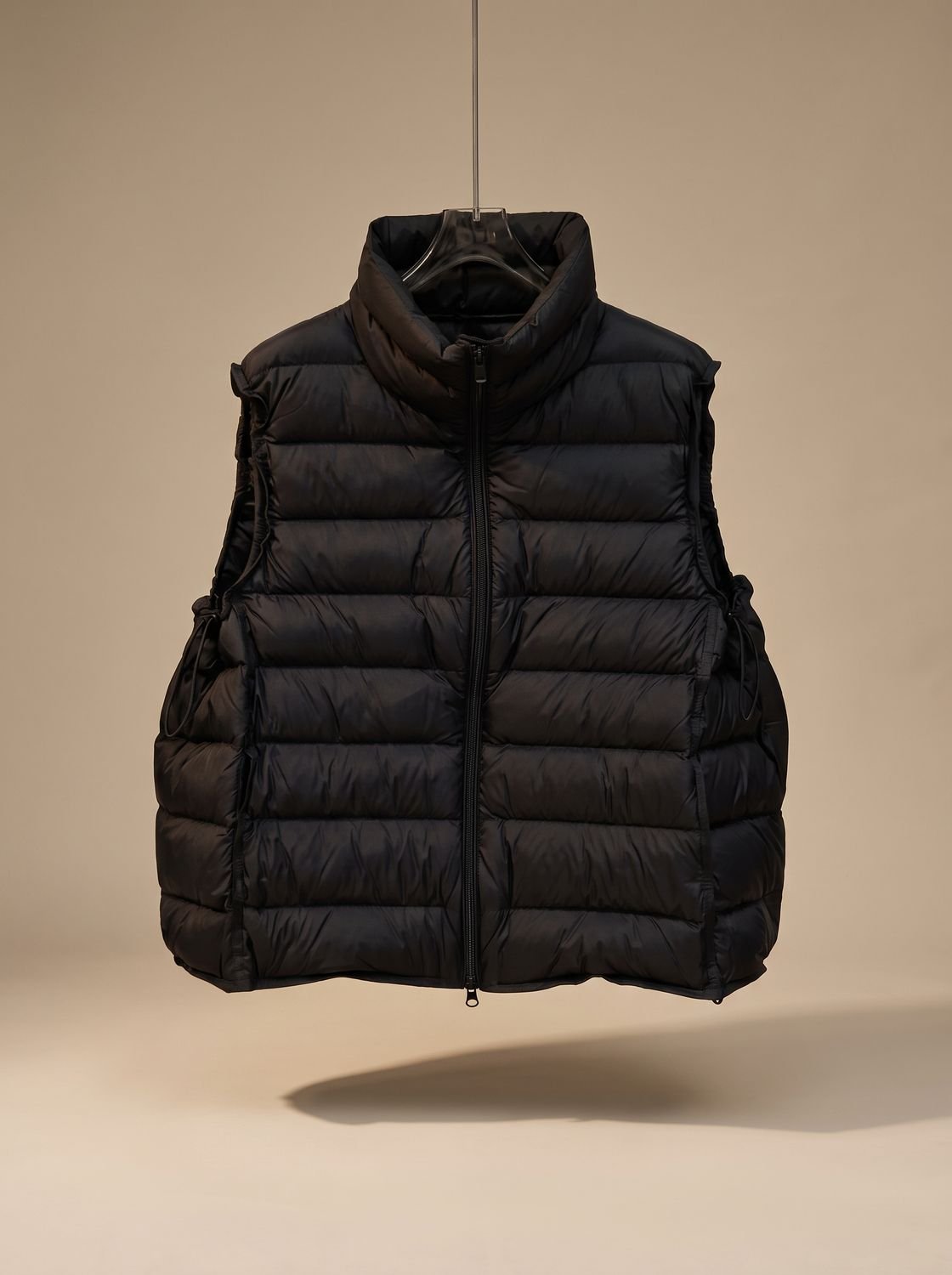 Women's lightweight sleeveless puffer vest with stand collar and two-way zipper by Homixa, shown in a neutral color.