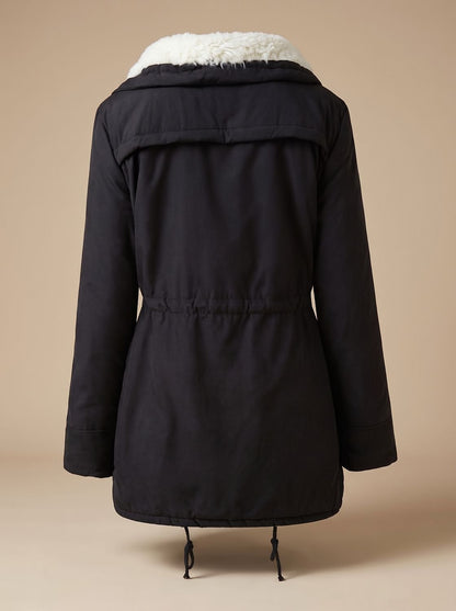 Women's Homixa winter parka with sherpa collar, drawstring waist, and front pockets, ideal for cold weather.