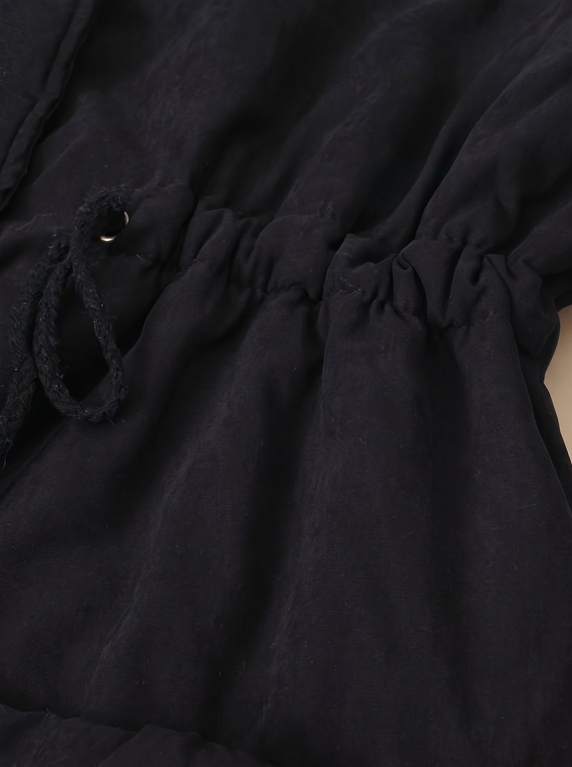 Women's Homixa winter parka with sherpa collar, drawstring waist, and front pockets, ideal for cold weather.
