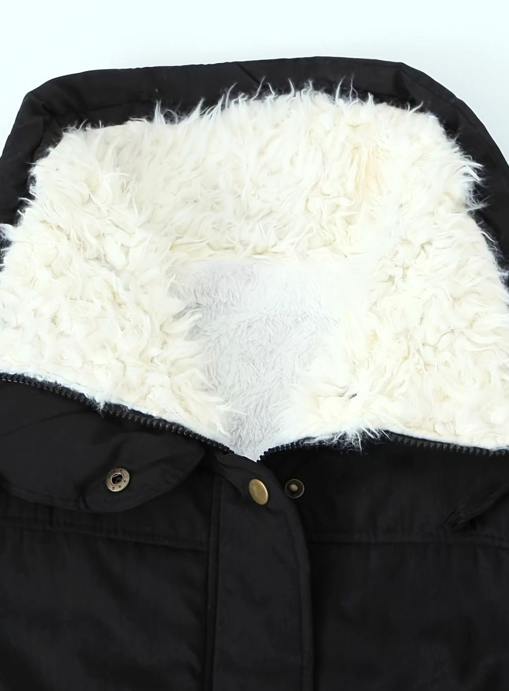 Women's Homixa winter parka with teddy collar, lined interior, and adjustable drawstring waist for warmth and style.