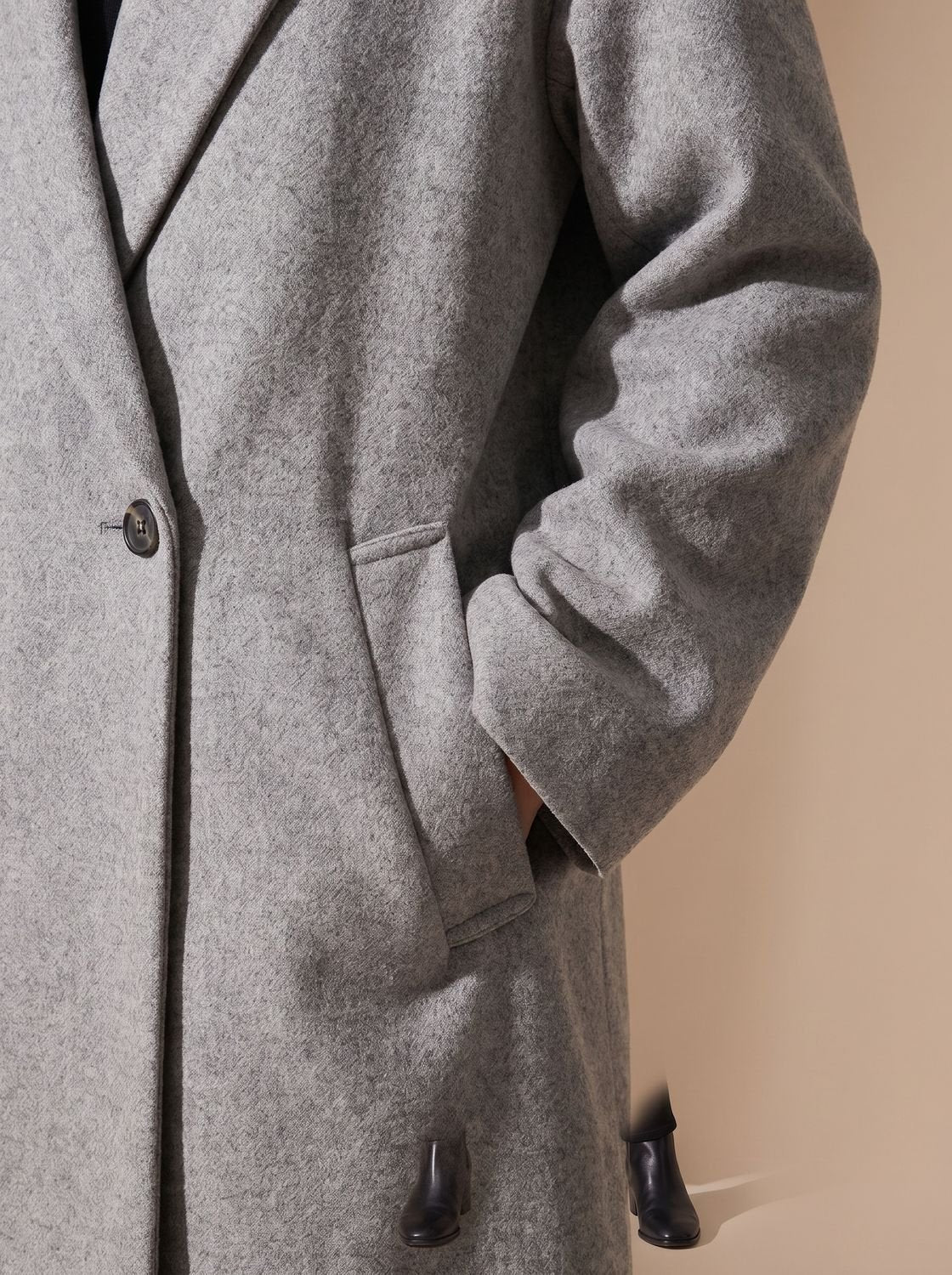 Women's long double-breasted overcoat by Homixa featuring a wide notched lapel collar and tailored fit.