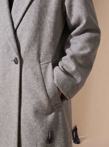 Women's long double-breasted overcoat by Homixa featuring a wide notched lapel collar and tailored fit.