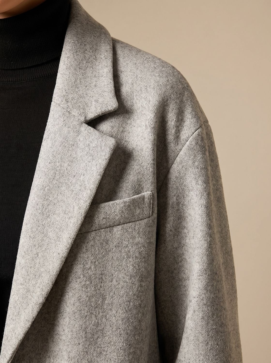 Women's long double-breasted overcoat by Homixa with a wide notched lapel collar, stylish and warm outerwear for fall and winter.