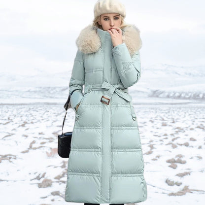 Women's long winter parka by Homixa with hood, water- and wind-repellent outer shell, suitable for cold, wet weather.
