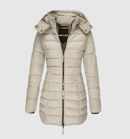 Women's long quilted winter puffer coat by Homixa with removable hood and front zipper, designed for warmth and style.